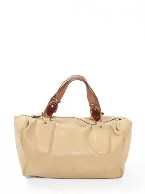 Sac duffle bag en cuir beige, anse marron noisette et pierre rouge bordeaux Px boutique 1500€ — photo 1