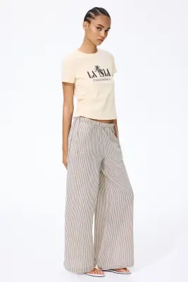 Pantalon en mousseline avec cordon de serrage - Beige clair/rayé — photo 1