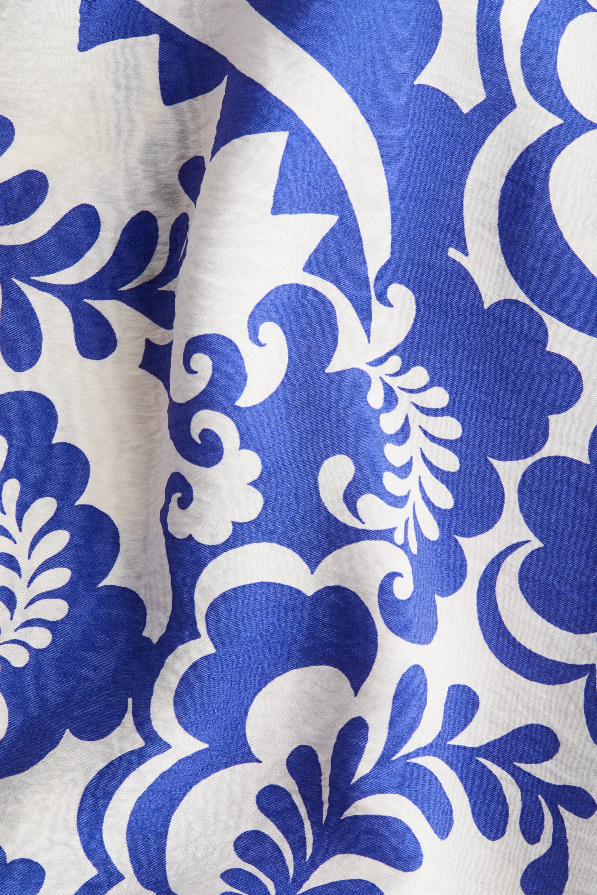 Robe avec jupe évasée - Blanc/motif bleu