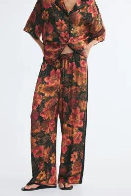 Pantalon en viscose avec bandes latérales - Noir/fleuri — photo 1