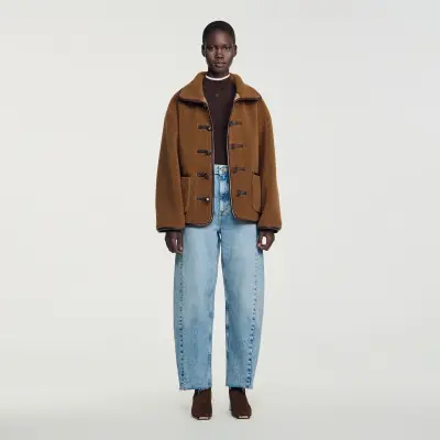 Manteau court en fausse fourrure