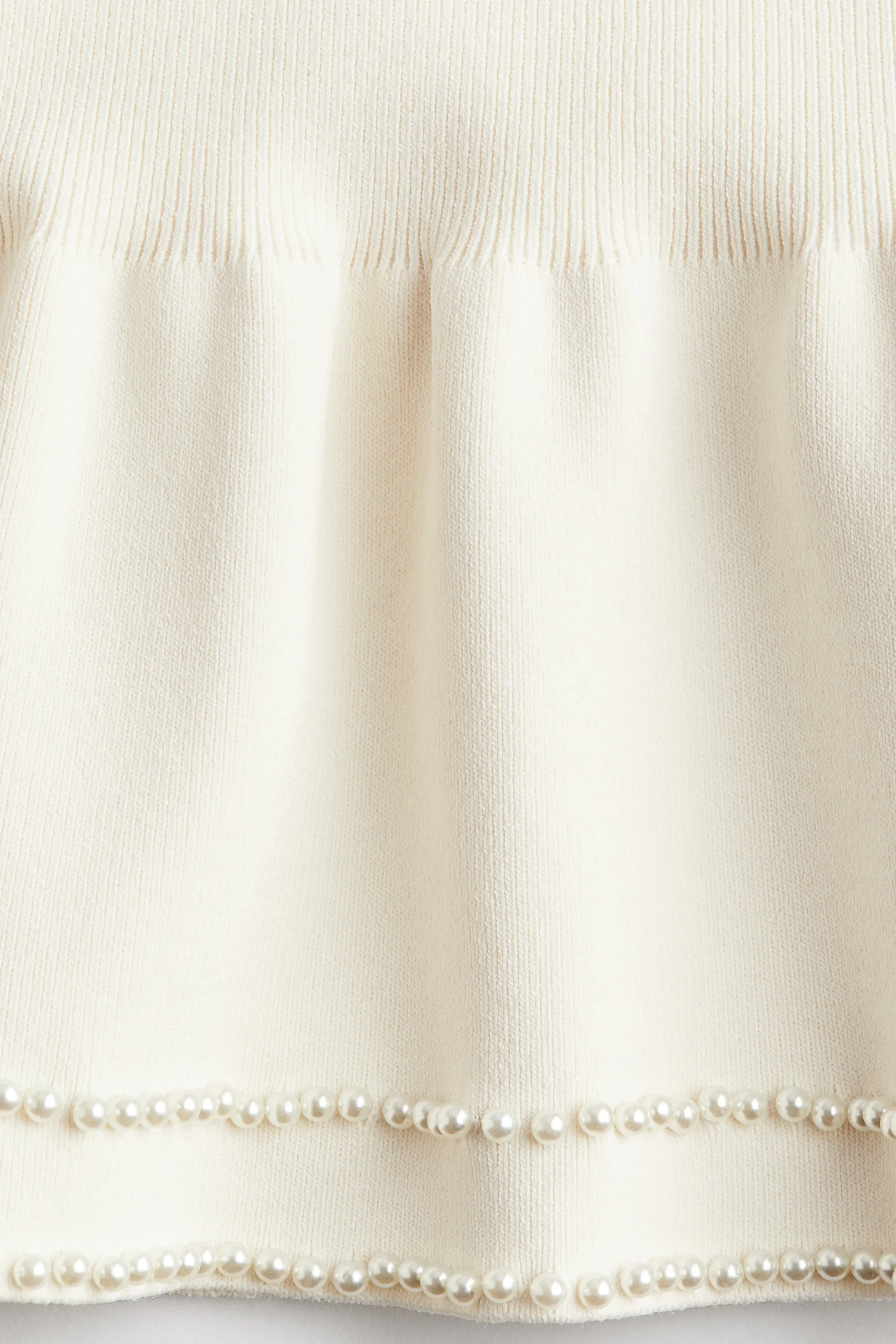 Jupe en maille ornée de perles fantaisie - Crème