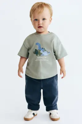 T-shirt imprimé en coton - Vert kaki clair/dinosaures — photo 1