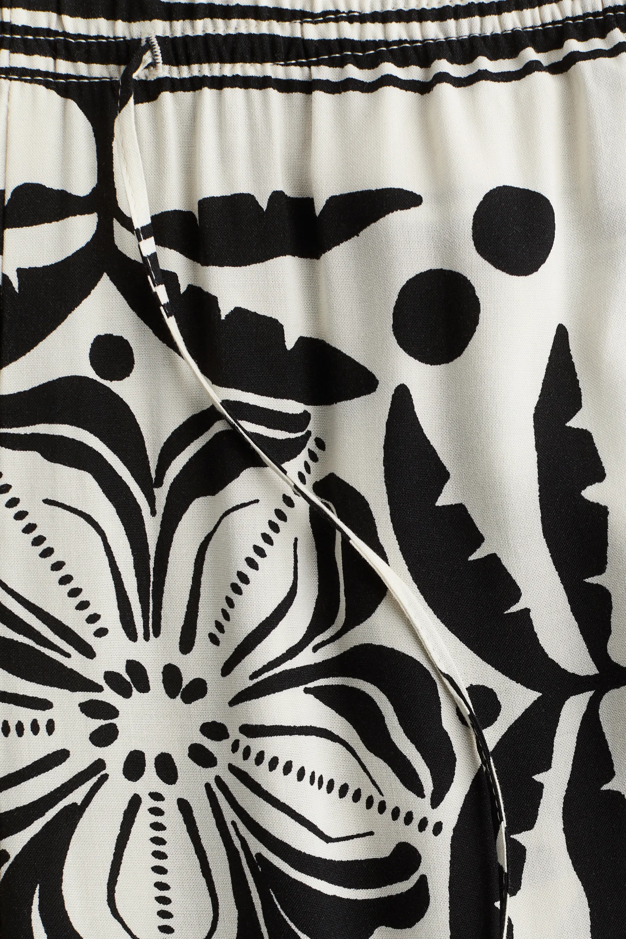 Pantalon large avec taille élastique - Crème/motif noir