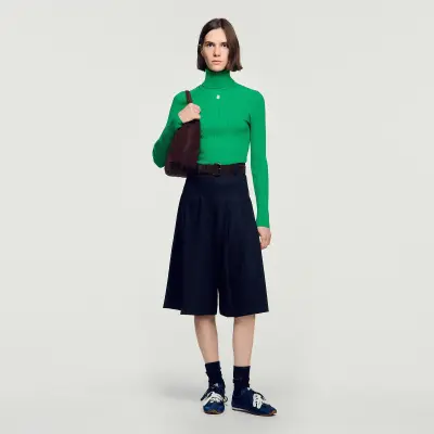 Pull col roulé en maille torsadée