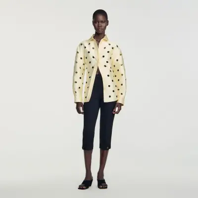Pantalon capri à plis cassés