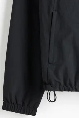 Veste coupe-vent à capuche - Noir — photo 1