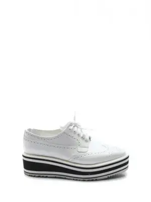 Baskets richelieu en cuir blanc semelle à rayures noir Prix boutique 600€ Taille 37,5
