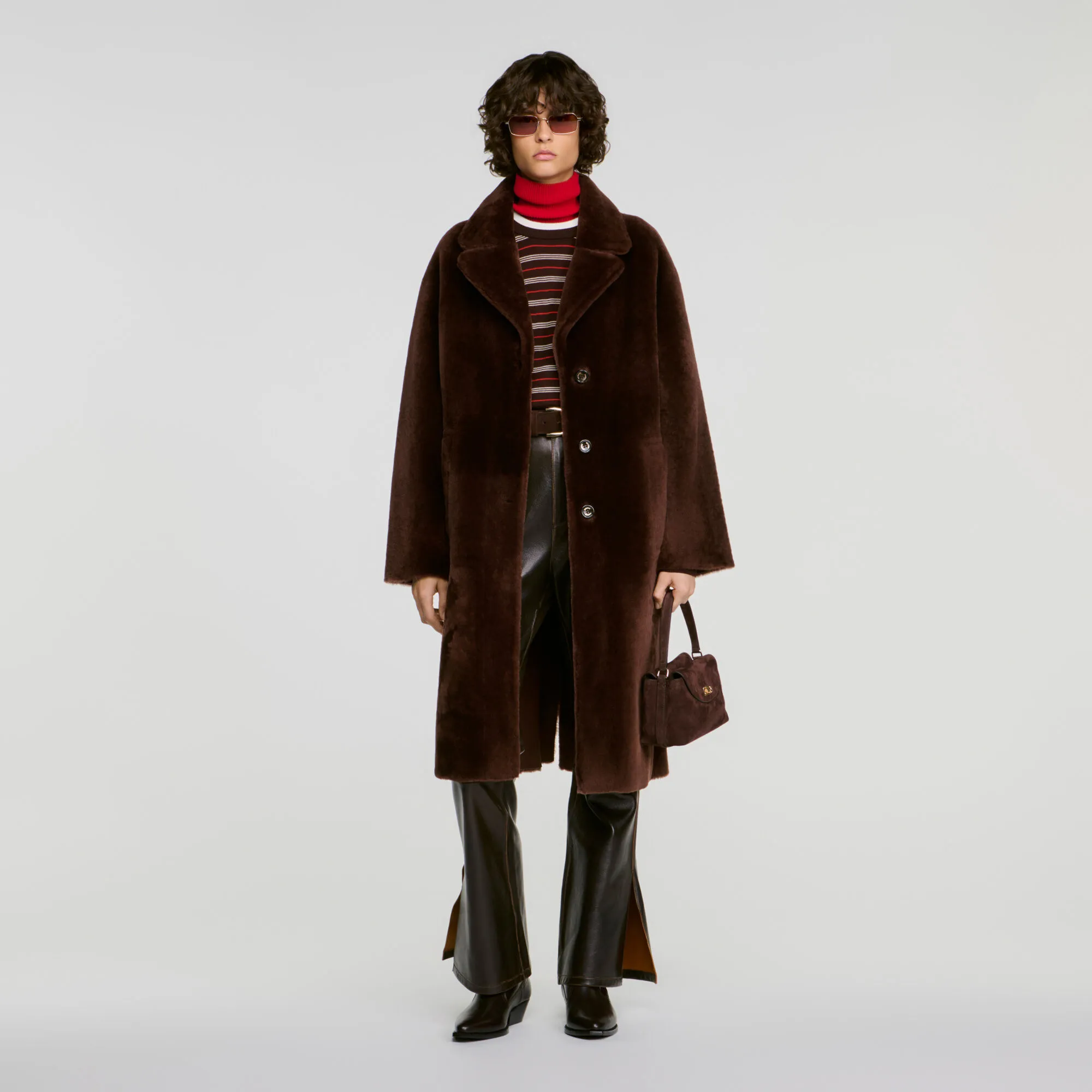 Manteau en peau lainée ceinturé