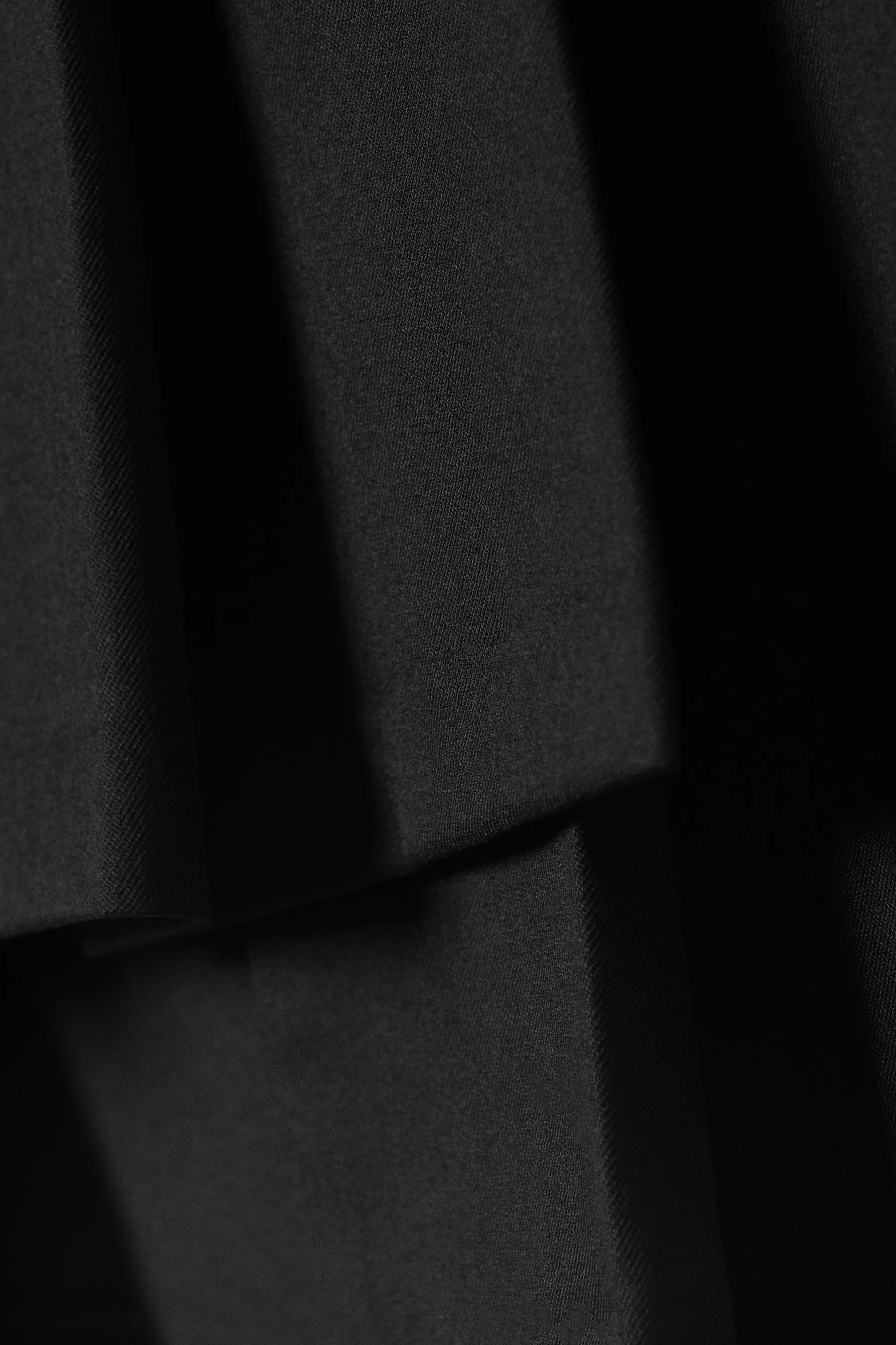 Mini-jupe portefeuille plissée asymétrique - Noir