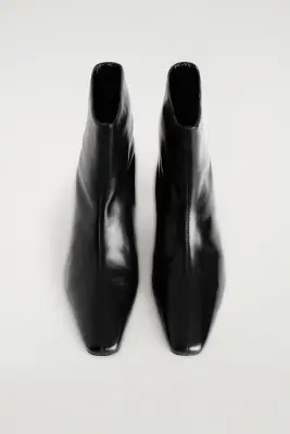 BOTTINES À TALON ANGULAIRE EN CUIR - NOIR — photo 1