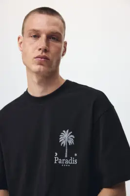 T-shirt imprimé Relaxed Fit en coton - Noir/Paradis — photo 1