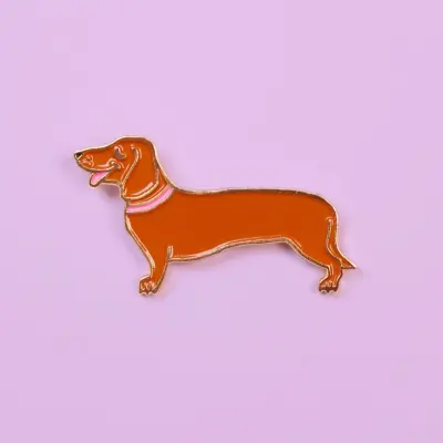 Pin's Teckel Coucou Suzette — photo 1